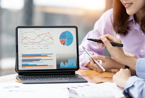 Accountant reviewing financial reports and charts